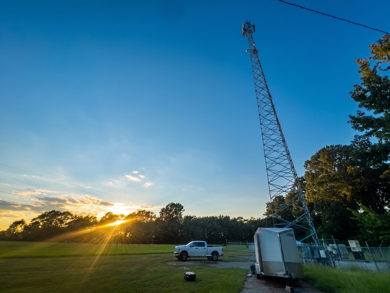An Alabama Lightwave wireless tower at dusk.